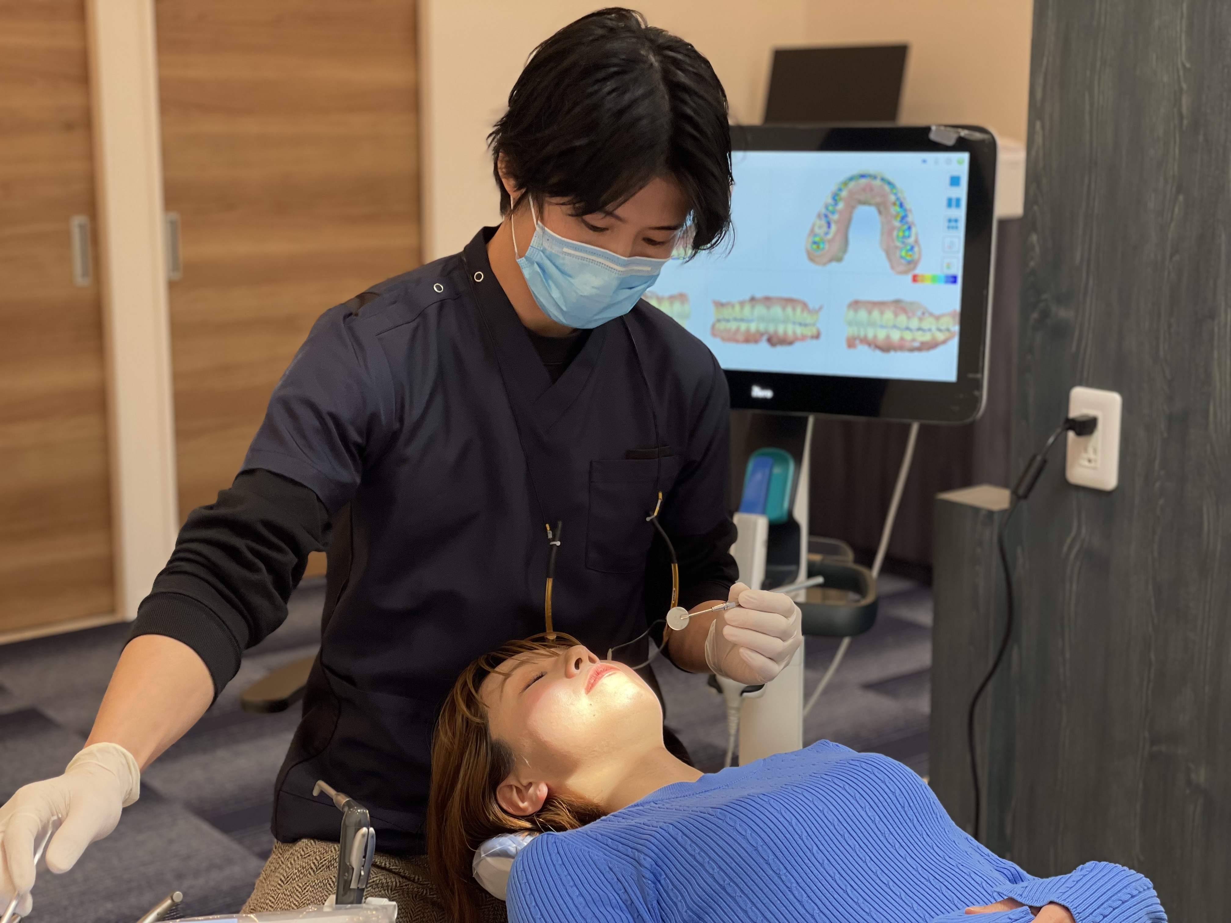 Young male dentist smiling